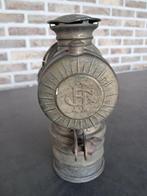 carbuur fietslamp, Ophalen