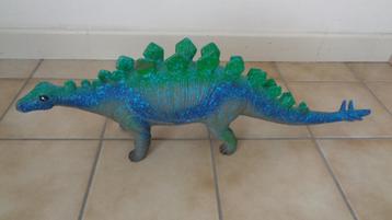 Grote bruine en groene dinosaurus beschikbaar voor biedingen