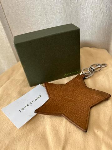 Longchamp camelleren sleutelhanger met ster beschikbaar voor biedingen