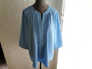 Blouse bleu clair. Taille L Neuve.