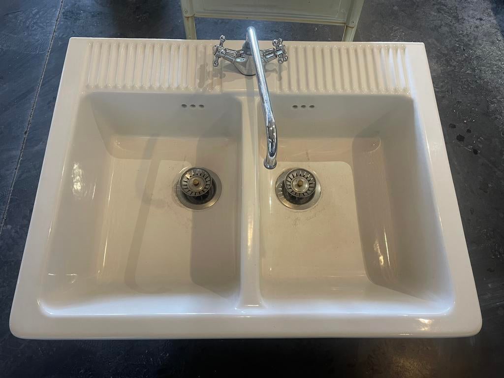 Dubbele spoelbak met kraan, Ophalen