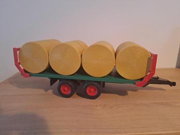 Bruder strobalenwagen met strobalen beschikbaar voor biedingen