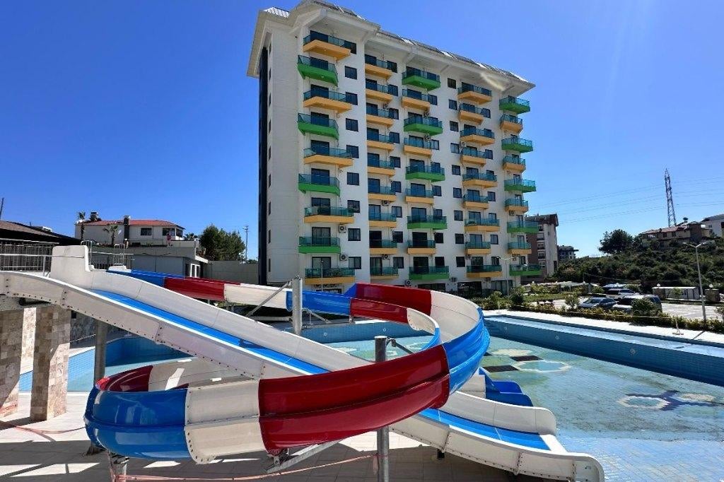 Compact 1+1 appartement met uitzicht op zee en de bergen, Immo, Buitenland, Turkije, Appartement, Stad