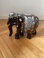 Éléphant en bois exotique, Ophalen