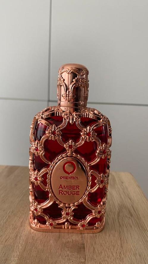 Orientica Amber Rouge, Handtassen en Accessoires, Uiterlijk | Parfum, Gebruikt, Ophalen of Verzenden