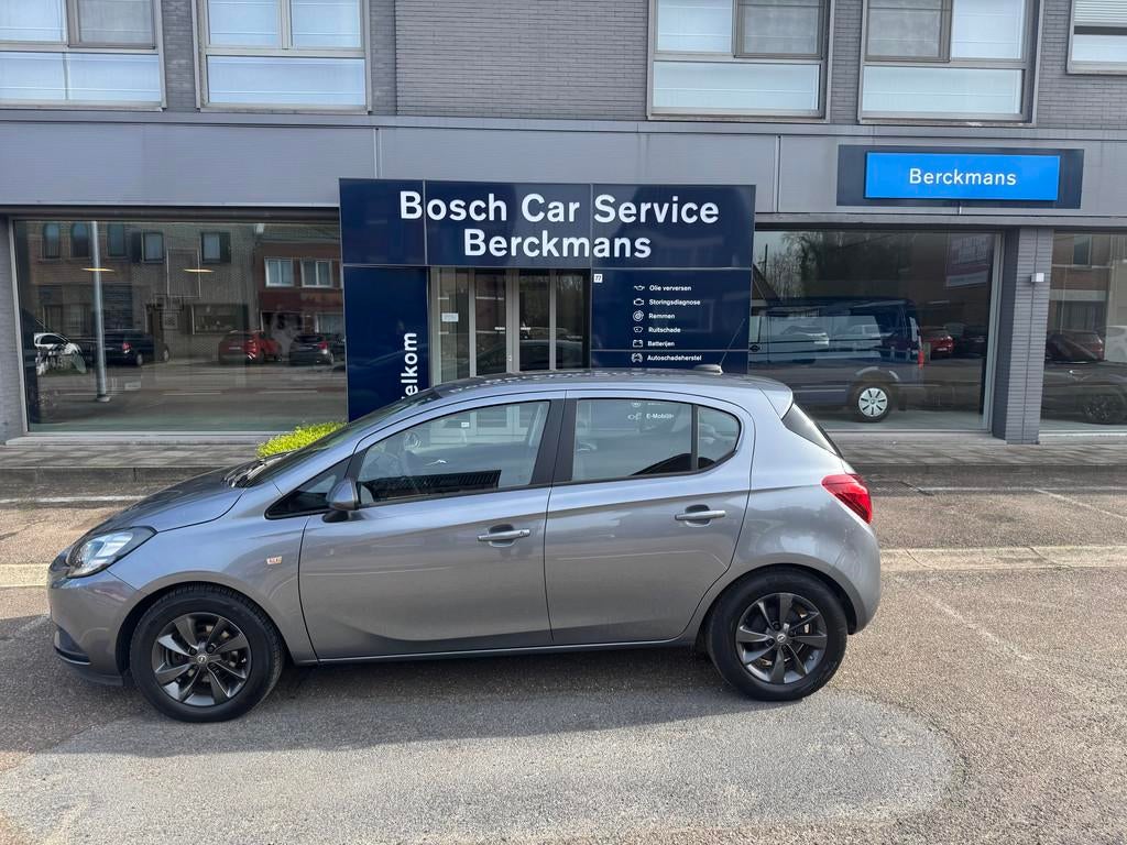 Opel Corsa Enjoy 1.4 Automaat met navigatie, slechts 34100KM, Auto's, Stof, Gebruikt, Euro 6, 4 cilinders