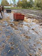 Slijk beu/ rubbermatten leggen