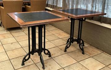 Tafels met gietijzeren poten beschikbaar voor biedingen