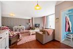 Gelijkvloers twee slaapkamerappartement te koop