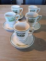 5 OXO mokken + 5 bordjes, Maison & Meubles, Cuisine | Vaisselle, Comme neuf, Enlèvement ou Envoi