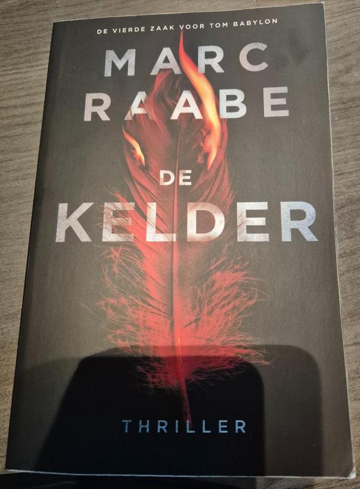 Marc Raabe - De kelder ..., Boeken, Thrillers, Zo goed als nieuw, Europa overig, Ophalen of Verzenden