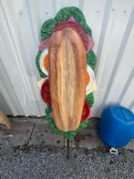 Reclame bord voor broodjes, Ophalen