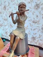 Bronzen beeld meisje met fluit, Ophalen