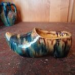 Klomp in aardewerk, Ophalen