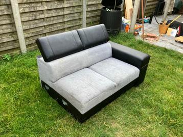 zwart grijze zetel (met kunstleder) beschikbaar voor biedingen