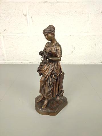 Bronzen beeld van een breister beschikbaar voor biedingen