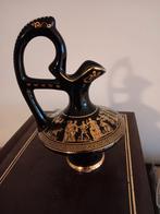 Grieks kruikje 24 karaat verguld, Ophalen