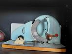 Vintage snijmachine, Ophalen