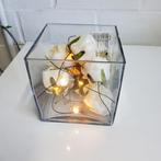 Kerststukje met licht, Ophalen
