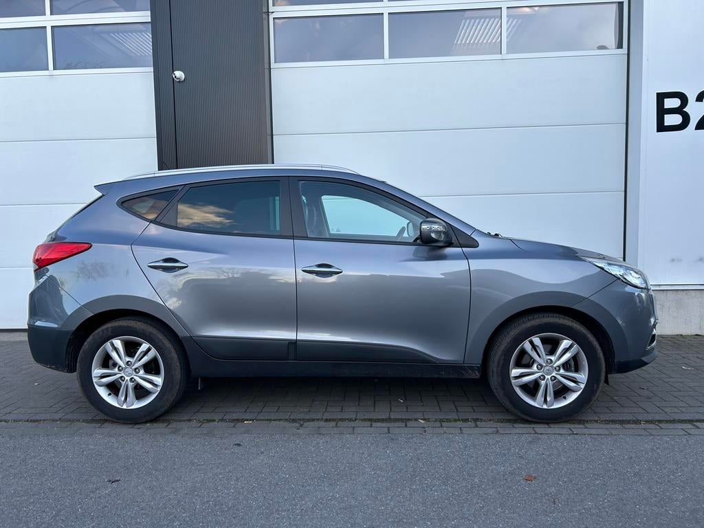 Hyundai IX35 1.6i met 77000km 1ste eigenaar, Auto's, Hyundai, Euro 5, Zwart, Leder, Handgeschakeld