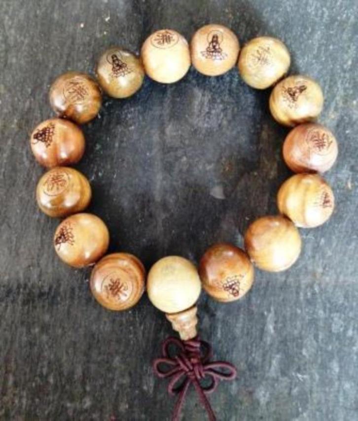 Sandelhout Boeddha armband uit Tibet, Handtassen en Accessoires, Armbanden, Nieuw, Hout, Bruin, Met bedels of kralen, Ophalen of Verzenden