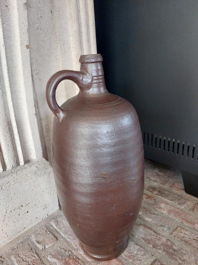 Oude stenen kruik, Ophalen