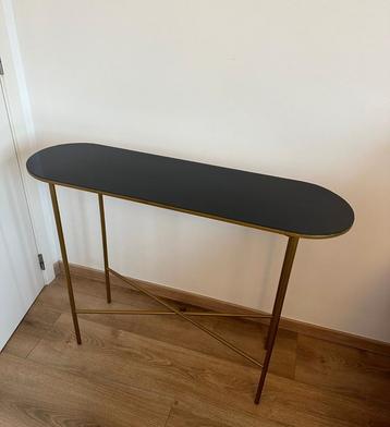 Console van goud en zwart metaal beschikbaar voor biedingen