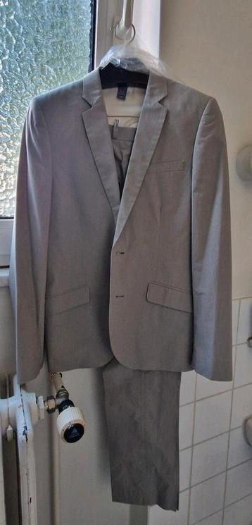 H&M kostuum lichtgrijs maat 44 beschikbaar voor biedingen