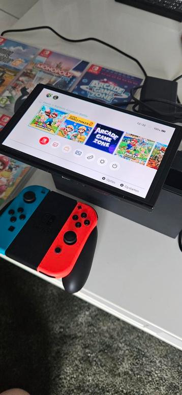 Nintendo switch oled + 5spelletjes beschikbaar voor biedingen