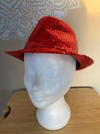 Rood feesthoedje met lovertjes, Ophalen