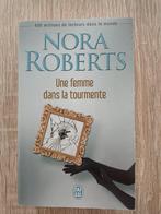 Une femme dans la tourmente - Nora Roberts, Livres, Romans, Comme neuf, Enlèvement, Nora Roberts