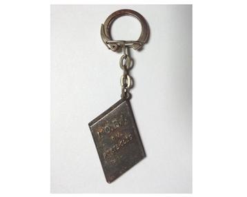 Porte-clés publicitaire vintage journal l'OBI des années 60 beschikbaar voor biedingen