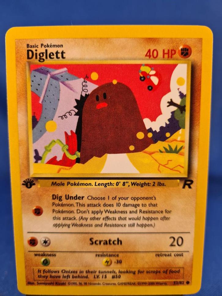 Diglett 52/82 - Team Rocket (1st edition), Hobby en Vrije tijd, Verzamelkaartspellen | Pokémon, Gebruikt, Verzenden