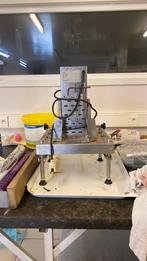 Chocolade schilfers machine, Ophalen