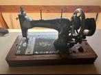 Antiek naaimachine, Ophalen