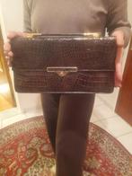 Vintage tas krokodil, Enlèvement