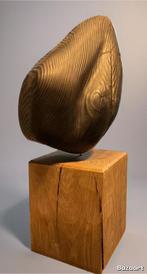 Vol houten sculptuur, Ophalen