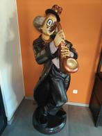 Grote clown met saxofoon