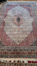 Handgeknoopt wollen tapijt uit Pakistan, Ophalen