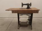 Antieke naaimachine, Ophalen