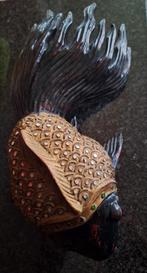 Chineese houten vis, Ophalen