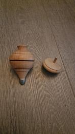 Houten speelgoed tollen, Ophalen
