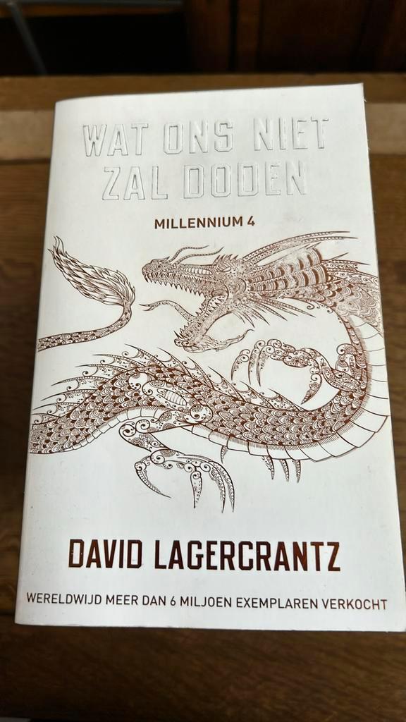 David Lagercrantz - Wat ons niet zal doden, Boeken, Thrillers, Zo goed als nieuw, Ophalen of Verzenden