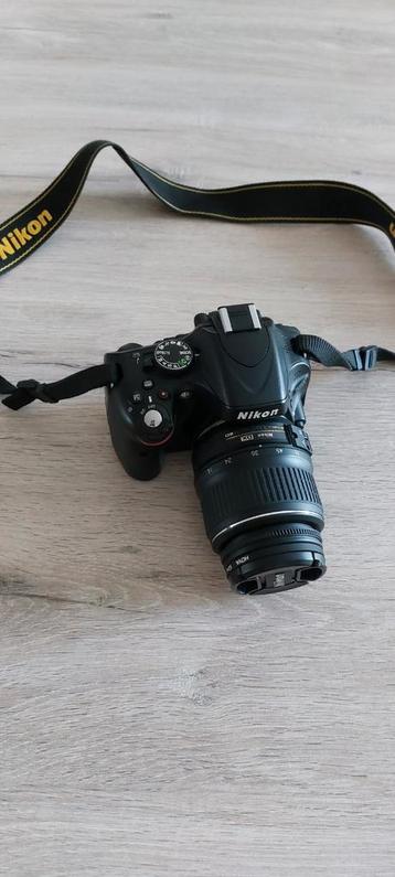 Nikon D5100 body en lens te koop. 