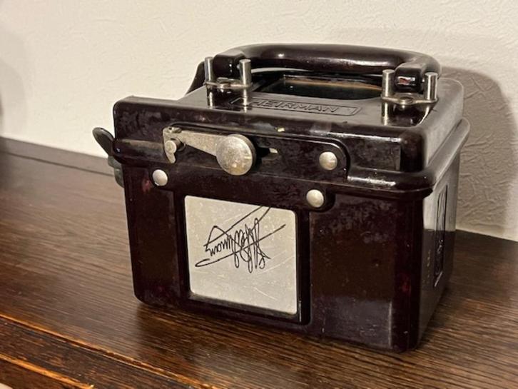 Vintage duivenklok (constateur) uit bakeliet van Heirman, Antiek en Kunst, Curiosa en Brocante, Ophalen