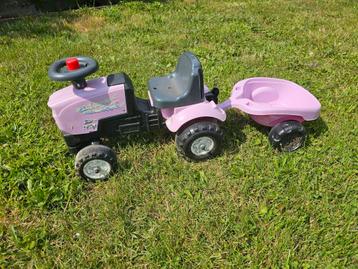 Roze looptractor met aanhangertje beschikbaar voor biedingen