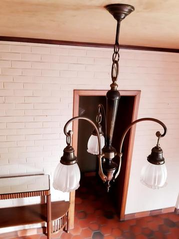 Antieke koperen luster beschikbaar voor biedingen