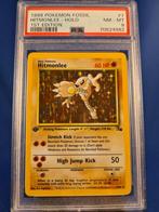 Hitmonlee 7/62 - Fossil (1st edition) (PSA 8), Hobby en Vrije tijd, Verzamelkaartspellen | Pokémon, Verzenden, Zo goed als nieuw