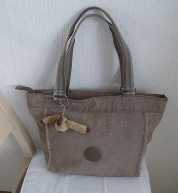 Beige hand- of schoudertas + aap beschikbaar voor biedingen
